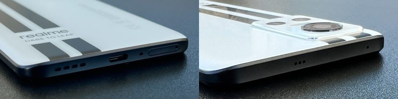 Realme GT Neo 3:n pohjasta löytyvät USB-C-liitäntä, SIM-korttikelkka sekä kaiutin- ja mikrofoniaukot. Yläpäässä on aukot toiselle kaiuttimelle ja mikrofonille.