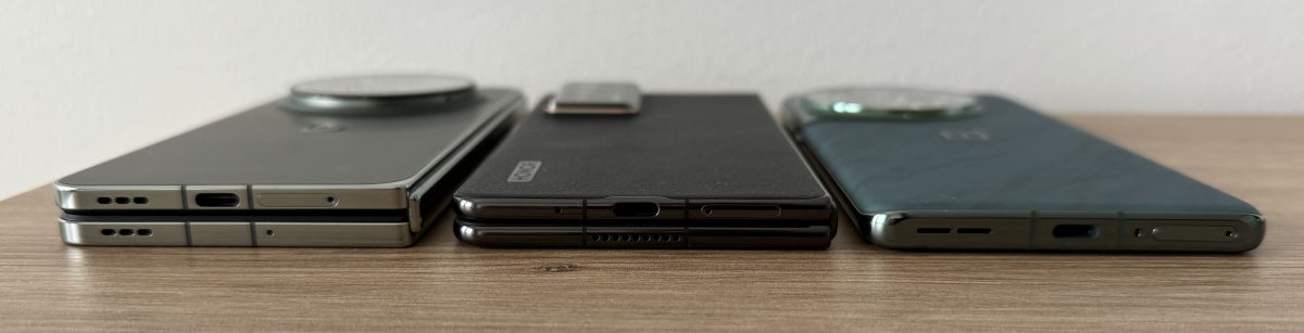 Keskellä 9,9 millimetriä paksu Magic V2. Vasemmalla 11,7 millimetriä paksu, taittuvalla näytöllä myös varustettu OnePlus Open. Oikealla 9,15 millimetriä paksu OnePlus 12.